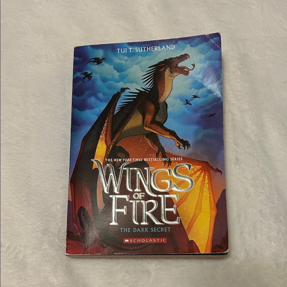 Scholastic Wings of Fire: The Dark Secret - Blue and Orange Cover